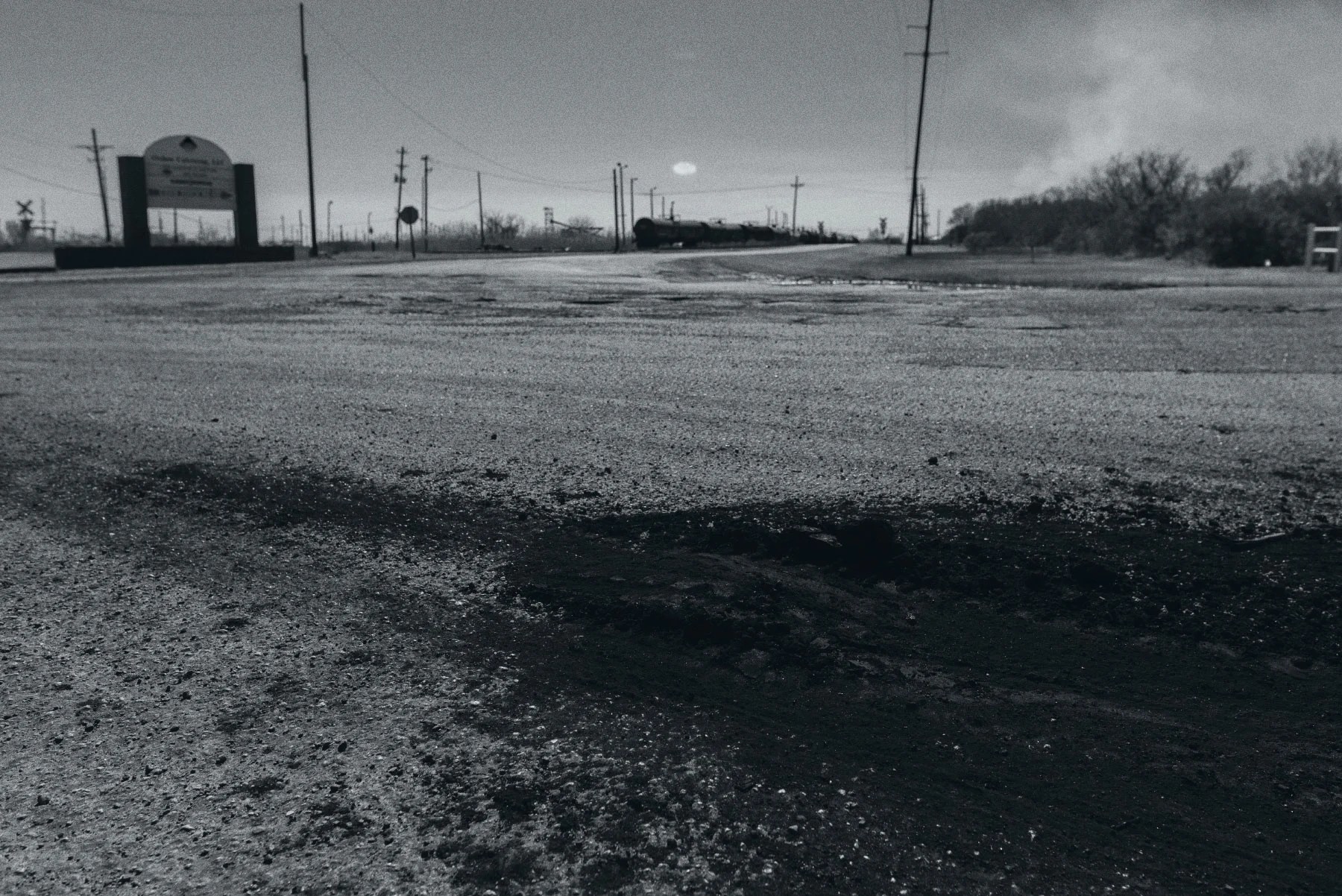 Chunks of petroleum coke near industrial facility